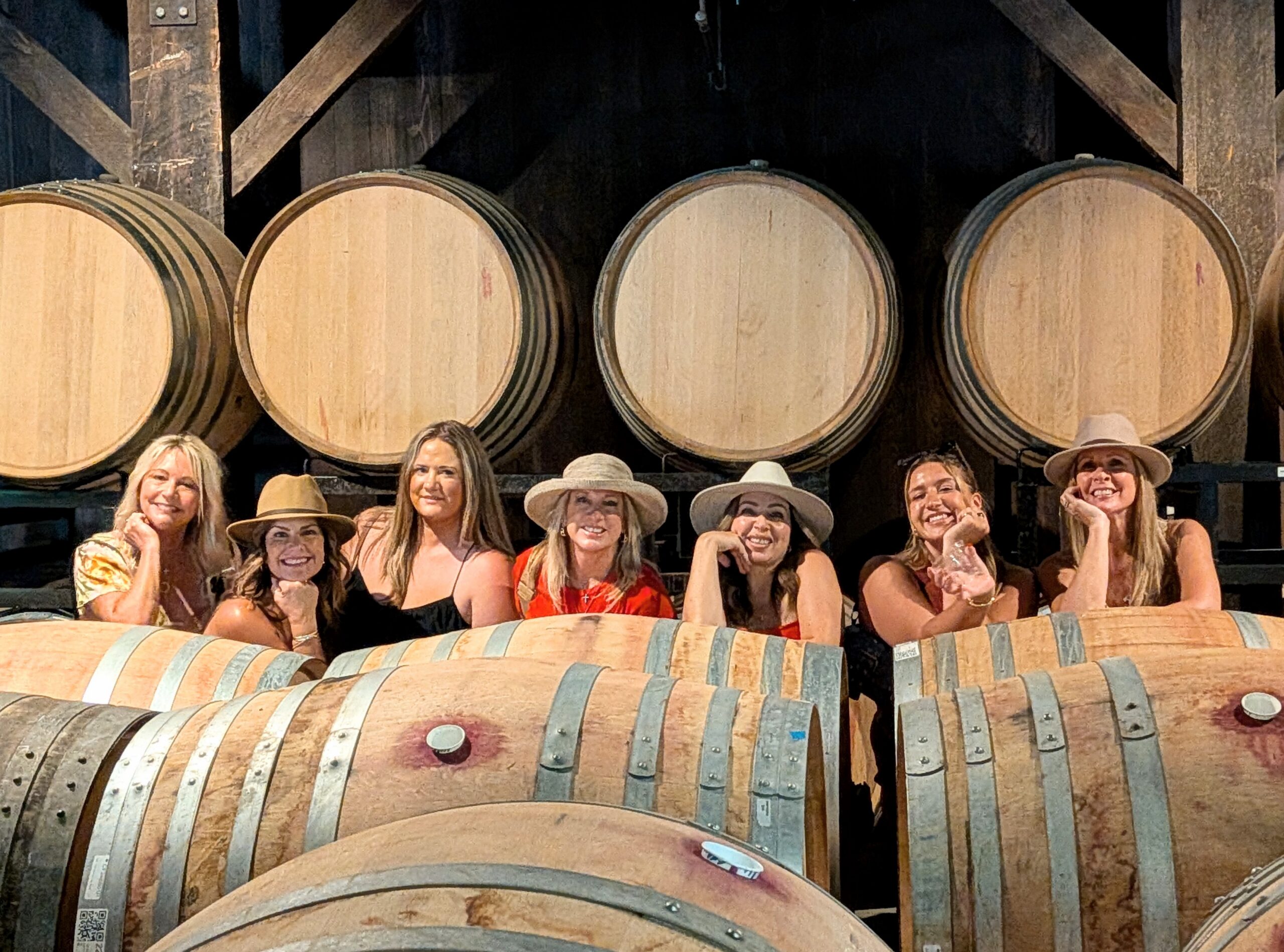 Barrels of wine & happy guests with Bliss Wine Tours!
